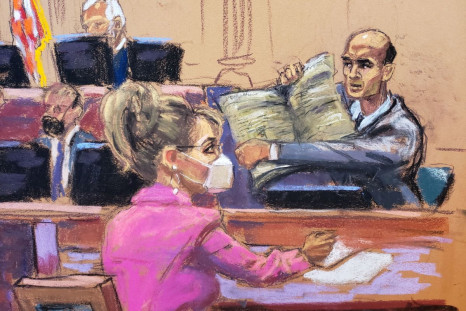 NY Times attorney David Axelrod questions James Bennet, who holds up a copy of the the New York Times newspaper paper, as Sarah Palin, 2008 Republican vice presidential candidate and former Alaska governor, watches during Palin's defamation lawsuit trial 