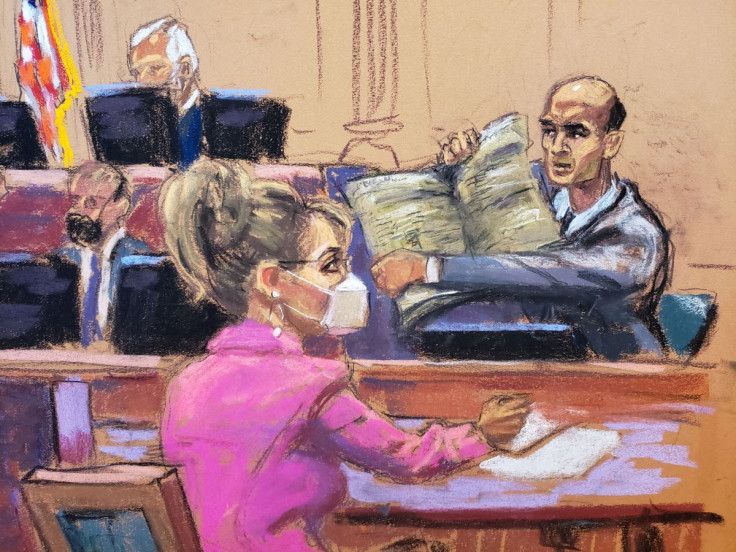 NY Times attorney David Axelrod questions James Bennet, who holds up a copy of the the New York Times newspaper paper, as Sarah Palin, 2008 Republican vice presidential candidate and former Alaska governor, watches during Palin's defamation lawsuit trial 