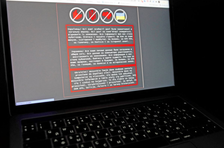 AÂ laptopÂ screenÂ displays a warning message in Ukrainian, Russian and Polish, that appeared on the official website of the Ukrainian Foreign Ministry after a massive cyberattack, in this illustration taken January 14, 2022. 