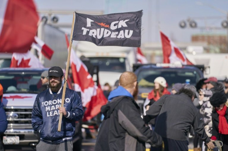 Anti vaccine mandate protesters block the roadway at the Ambassador Bridge border crossing, in Windsor, Ontario on February 9, 2022