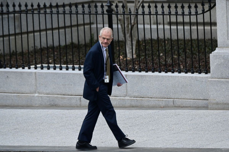 White House advisor Peter Navarro leaves the West Wing carrying a poster board displaying claims of voting irregularity at the White House in Washington, U.S., January 15, 2021. 
