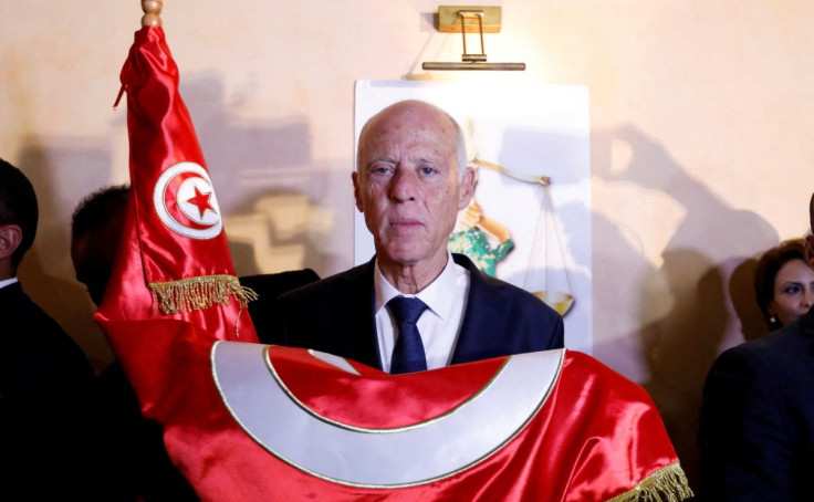 Tunisian presidential candidate Kais Saied reacts after exit poll results were announced in a second round runoff of the presidential election in Tunis, Tunisia October 13, 2019.