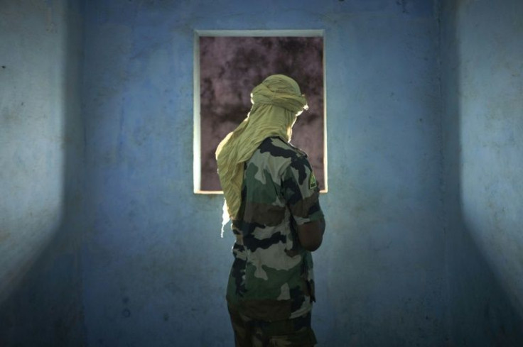 'Malick,' a soldier. One day his convoy struck a huge roadside bomb. Survivors came under fire from jihadists hiding in tall grass