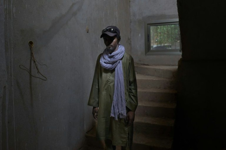 A life in the shadows: This man, who is anonymous, worked for eight months for the jihadists and then fled to a refugee camp in Mauritania. When he was photographed by AFP, he was hiding in a building that was under construction