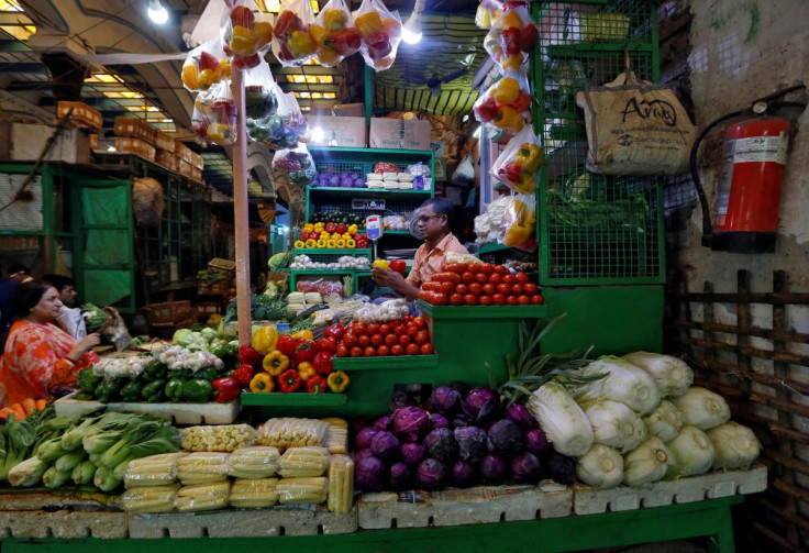 A vendor sells vegetables at a retail market in Kolkata, India, December 12, 2018. 