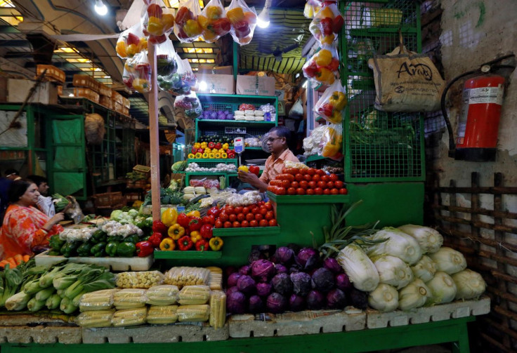 A vendor sells vegetables at a retail market in Kolkata, India, December 12, 2018.