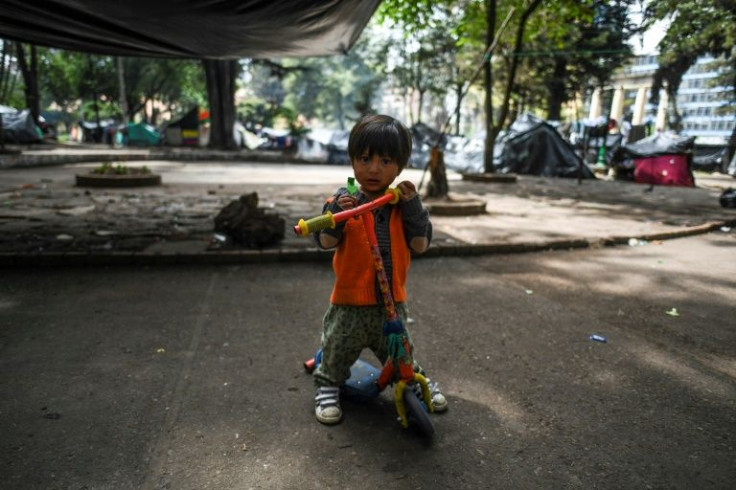 An Embera indigenous child plays in a makeshift camp