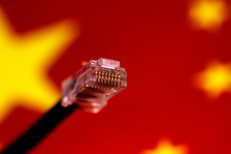 A computer network cable is seen above a Chinese flag in this July 12, 2017 illustration photo.   