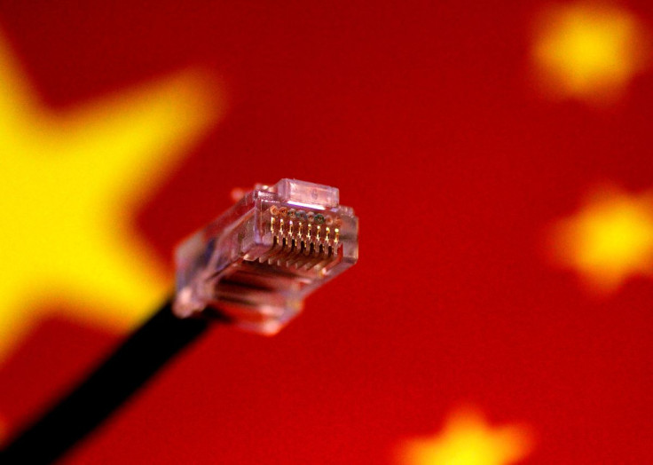 A computer network cable is seen above a Chinese flag in this July 12, 2017 illustration photo.   