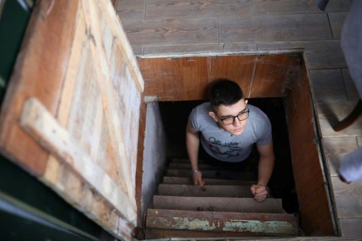 Ilya Zhelnovatskiy, 16, says the bomb shelter under his kitchen 'has saved our lives several times'