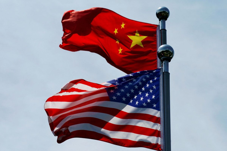 Chinese and U.S. flags flutter near The Bund, before U.S. trade delegation meet their Chinese counterparts for talks in Shanghai, China July 30, 2019. 