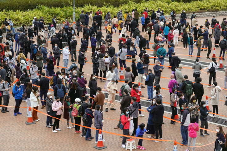 People queue at a makeshift nucleic acid testing centre for the coronavirus disease (COVID-19), at the Central district in Hong Kong, China, February 9, 2022. 