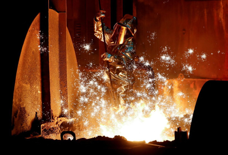 A steel worker for Germany's industrial conglomerate ThyssenKrupp AG takes a sample of raw iron from a blast furnace at Germany's largest steel factory in Duisburg, Germany, January 28, 2019.