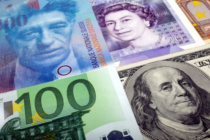 A picture illustration of U.S. dollar, Swiss Franc, British pound and Euro bank notes, taken in Warsaw January 26, 2011. 