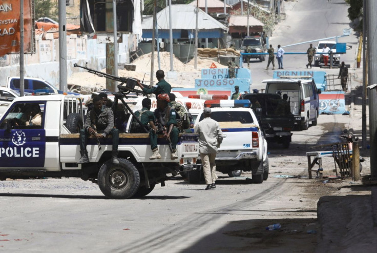 Somali security secure the road leading to the scene of an explosion at a checkpoint near the Presidential palace in Mogadishu, Somalia, February 10, 2022.