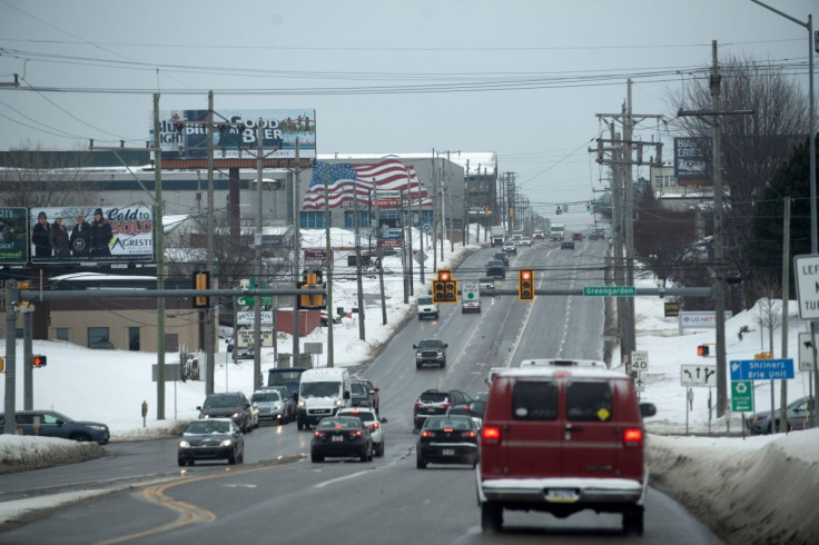 Vehicles travel along the 12th Street corridor in Erie, Pennsylvania, U.S., February 8, 2022. Erie officials are hoping to revitalize a handful of dilapidated industrial buildings along the road with federal infrastructure dollars. 