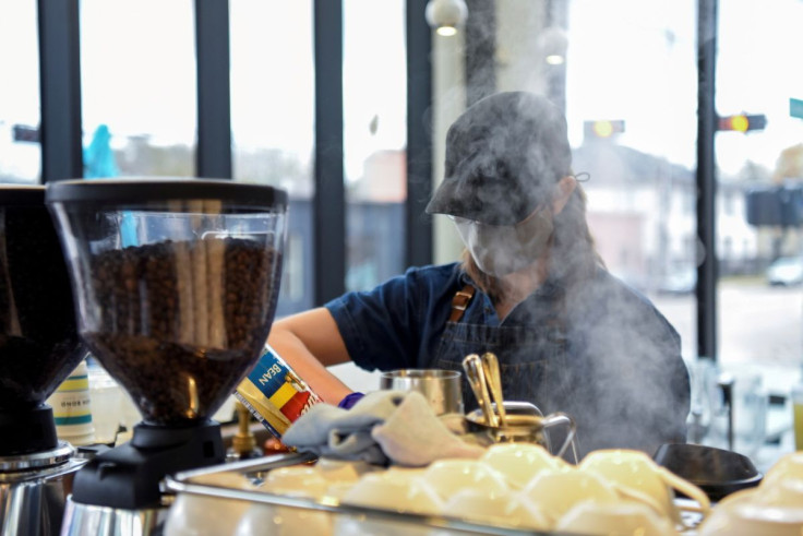 A barista makes coffee for a customer in Houston, Texas, U.S., March 10, 2021. 