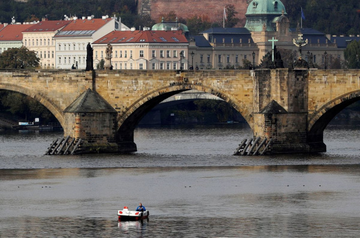 A man rides a pedal boat on the Vltava river in Prague, Czech Republic, October 21, 2020.