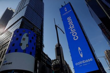The logo for Coinbase Global Inc, the biggest U.S. cryptocurrency exchange, is displayed on the Nasdaq MarketSite jumbotron and others at Times Square in New York, U.S., April 14, 2021. 