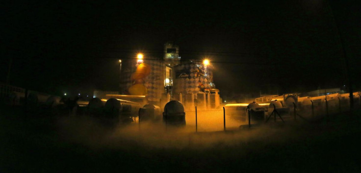 FILE PHOTO - Trucks line up in front of the German gas company Linde plant in Cubatao February 24, 2015.