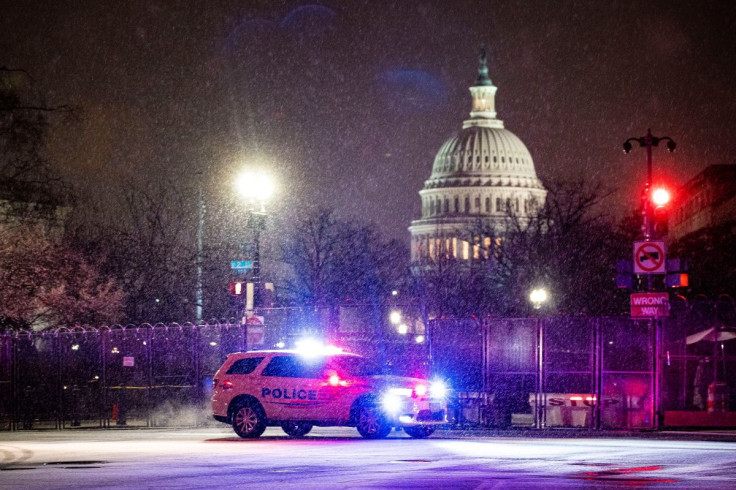 A Metropolitan Police Department car drives through the snow on Capitol Hill in Washington, U.S., January 25, 2021. 