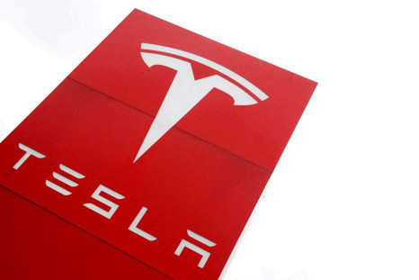 The logo of car manufacturer Tesla is seen at a dealership in London, Britain, May 14, 2021. 