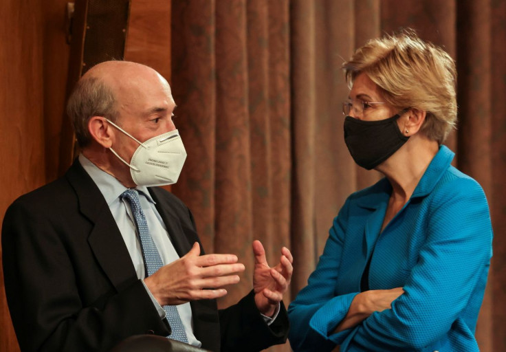 U.S. Securities and Exchange Commission (SEC) Chair Gary Gensler speaks with Senator Elizabeth Warren (D-MA) prior to testifying before a Senate Banking, Housing, and Urban Affairs Committee oversight hearing on the SEC on Capitol Hill in Washington, U.S.