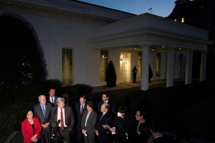 U.S. Senator Sheldon Whitehouse (D-RI) speaks at a microphone beside fellow Judiciary Committee Democrats, following a meeting on Supreme Court nomination process with U.S. President Joe Biden at the White House in Washington, U.S., February 10, 2022. 