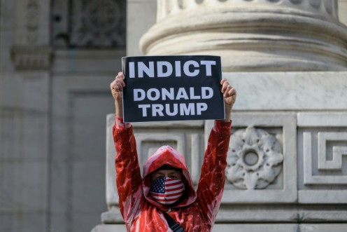 A protester in New York calls on January 6, 2022 for authorities to indict Donald Trump