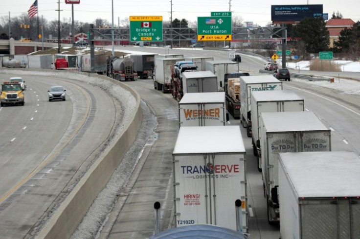 Trucks lined up at the Blue Water Bridge that connects Port Huron, Michigan and Sarnia, Canada in Port Huron, Michigan on February 10, 2022