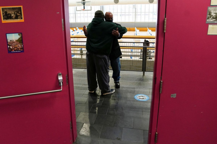 Criminally convicted New York State Representative Eddie Gibbs hugs a supporter in the community center before being ceremonially sworn in, in the Harlem area of the Manhattan borough of New York City, New York, U.S., February 10, 2022.