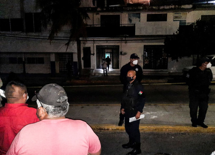 Police officers guard the perimeter of a scene where Heber Lopez, an independent journalist who ran NoticiasWeb, was shot and killed at his recording studio, in Salina Cruz, in Oaxaca state, Mexico February 10, 2022.