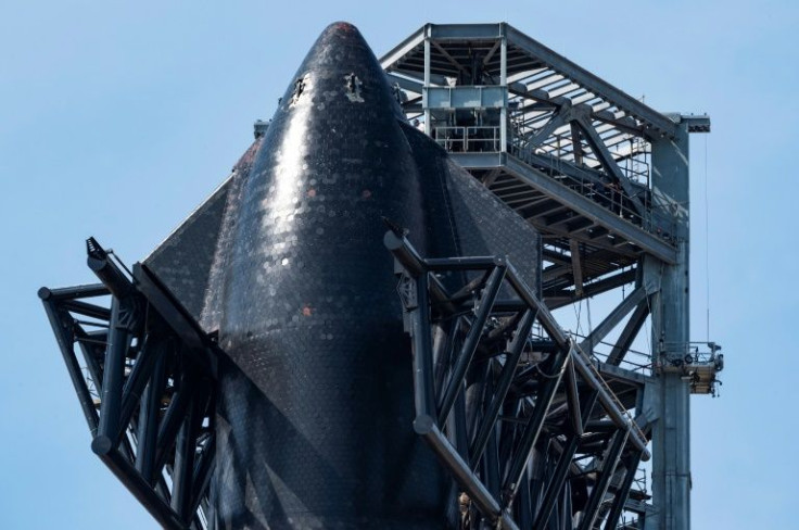 SpaceX's first orbital Starship SN20 is stacked atop its massive Super Heavy Booster 4 at the company's Starbase facility near Boca Chica Village in South Texas on February 10, 2022