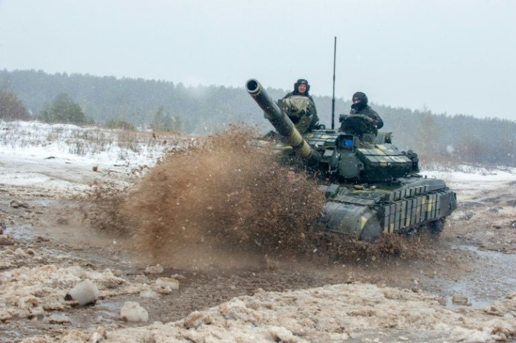 Ukrainian Military Forces servicemen of the 92nd mechanised brigade use tanks, self-propelled guns and other armoured vehicles to conduct live-fire exercises near the town of Chuguev, Kharkiv region on February 10, 2022