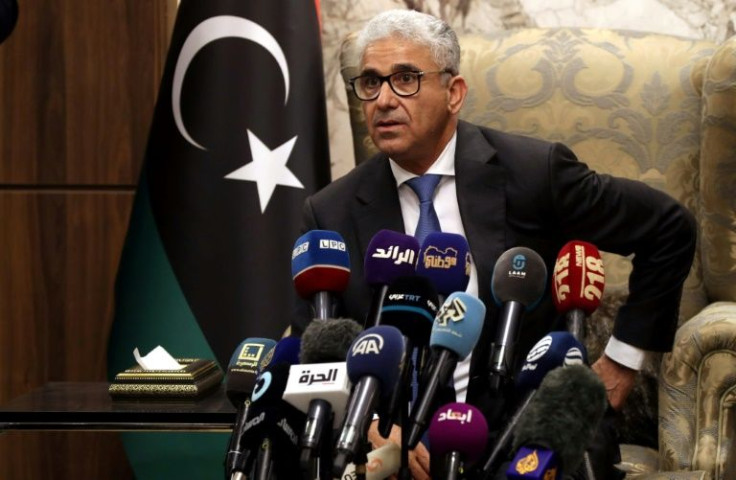 Libyan interim Prime Minister Fathi Bashagha, newly named by the Libyan parliament, delivers a speech at Mitiga International Airport in Tripoli on February 10, 2022
