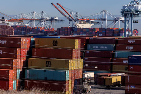 Stacked containers are shown as ships unload their cargo at the Port of Los Angeles in Los Angeles, California, U.S. November 22, 2021. 