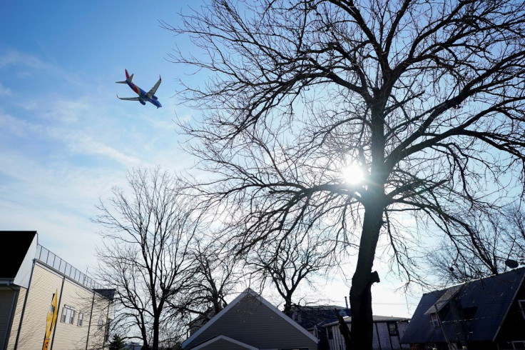 FILE PHOTO -A Southwest Airlines flight, equipped with radar altimeters that may conflict with telecom 5G technology, flies 500 feet above the ground while on final approach to land at LaGuardia Airport in New York City, New York, U.S., January 6, 2022. 