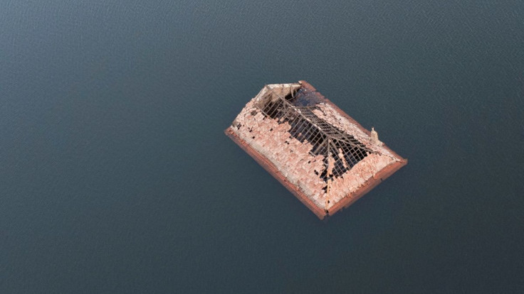 The roof of a house is seen in the ancient village of Aceredo that had been submerged by Limia river in the 1990s after the dam was built in Concello de Lobios, Spain, February 10, 2022. Picture taken February 10, 2022. Picture taken with a drone.