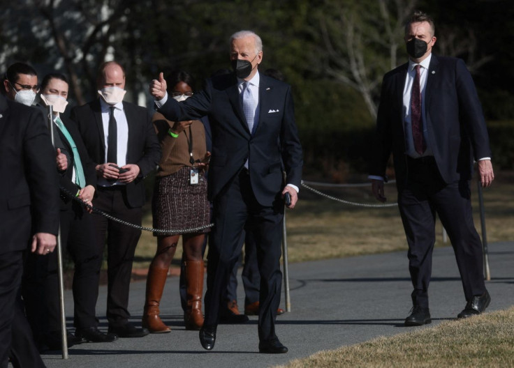 U.S. President Joe Biden gives a thumbs up before boarding Marine One for travel to Camp David from the White House in Washington, U.S., February 11, 2022.