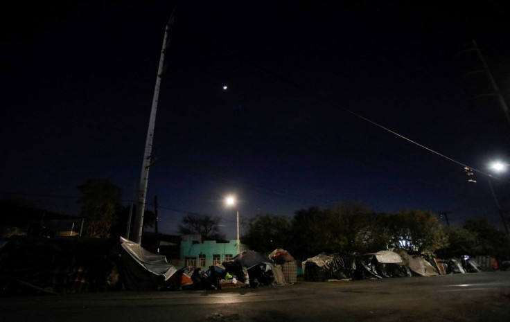 General view shows tents of migrants living in a makeshift camp outside a shelter while they get money to continue their trip heading to the U.S., in Monterrey, Mexico February 4, 2022.