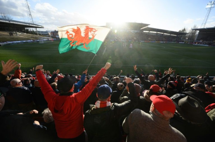 Wrexham fans celebrate a goal at the Racecourse Ground