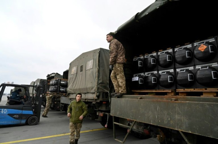 Ukrainian servicemen take delivery of FGM-148 Javelins, American man-portable anti-tank missiles provided by the US