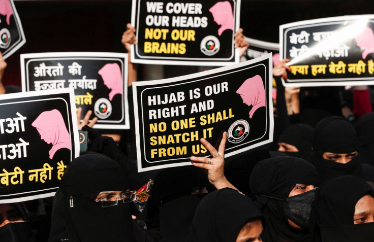 Women hold placards during a protest, organised by Hum Bhartiya, against the recent hijab ban in few colleges of Karnataka state, on the outskirts of Mumbai, India, February 11, 2022.