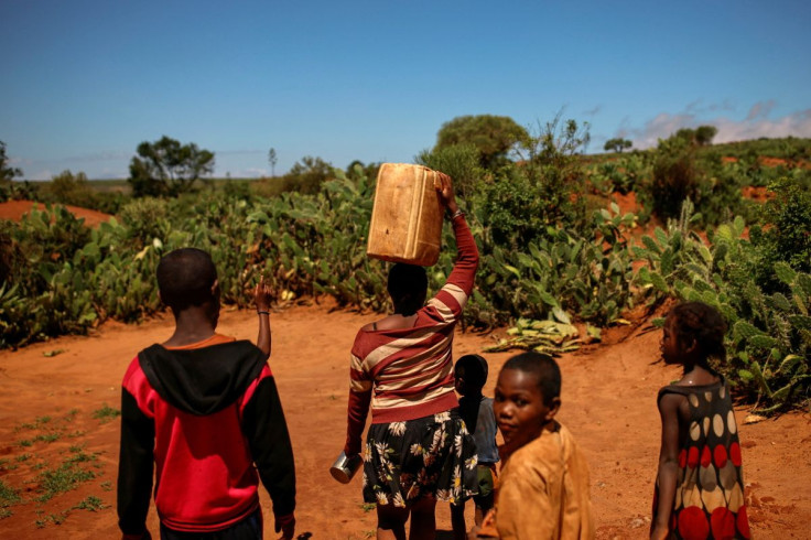 Local resident Masy carries an empty water canister in Sampona commune, Madagascar, February 11, 2022. Picture taken February 11, 2022.