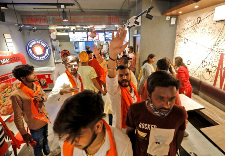 Activists of Bajrang Dal, a Hindu hardline group, shout slogans inside a Pizza Hut food outlet during a protest over their Pakistani partners' tweet in support of Kashmir, in Ahmedabad, India, February 12, 2022.