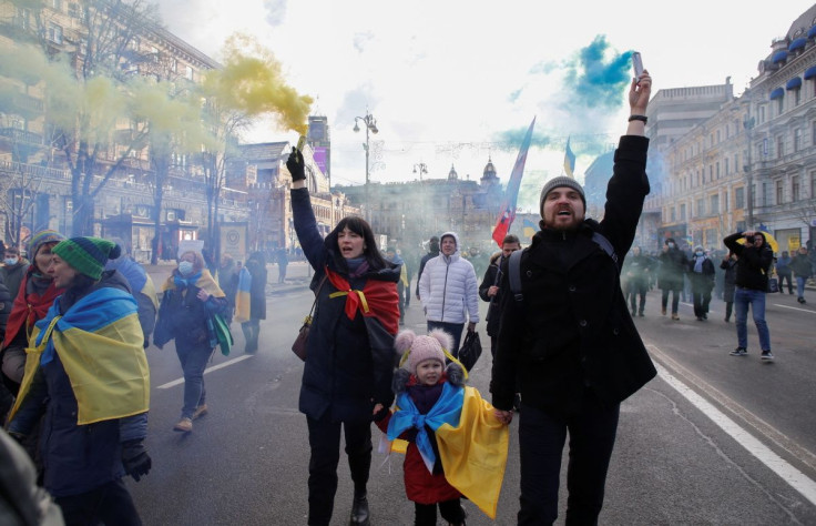 People take part in the Unity March, which is a procession to demonstrate Ukrainians' patriotic spirit amid growing tensions with Russia, in Kyiv, Ukraine February 12, 2022.