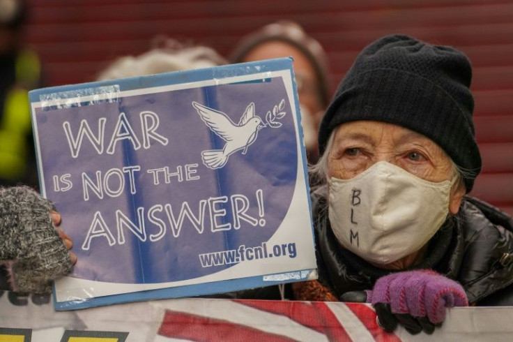 Ukrainians sang the national anthem and voiced anger at Russian President Vladimir Putin at march across Kyiv that drew thousands