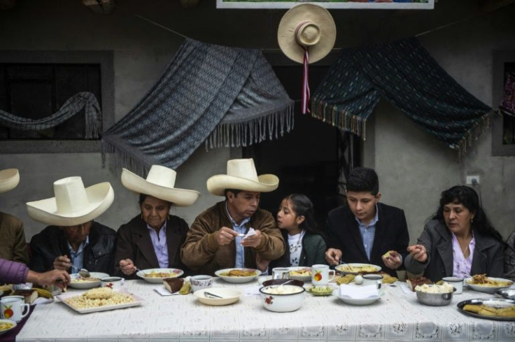 Pedro Castillo (centre) and his parents all wore the chotano hat while having breakfast on the day of Peru's second round election run-off in June 2021