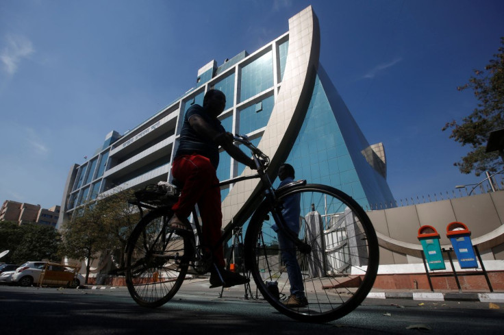 A man rides his bicycle past India's Central Bureau of Investigation (CBI) headquarters building in New Delhi, India, March 6, 2018.