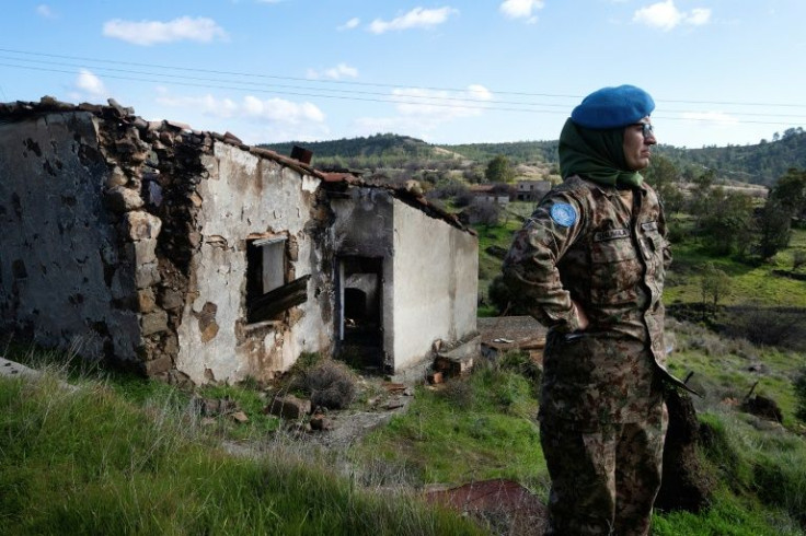 A UN peacekeeper in the long-abandoned village of Variseia (Varisha) in the buffer zone separating the Republic of Cyprus and the Turkish-occupied north, on January 27, 2022
